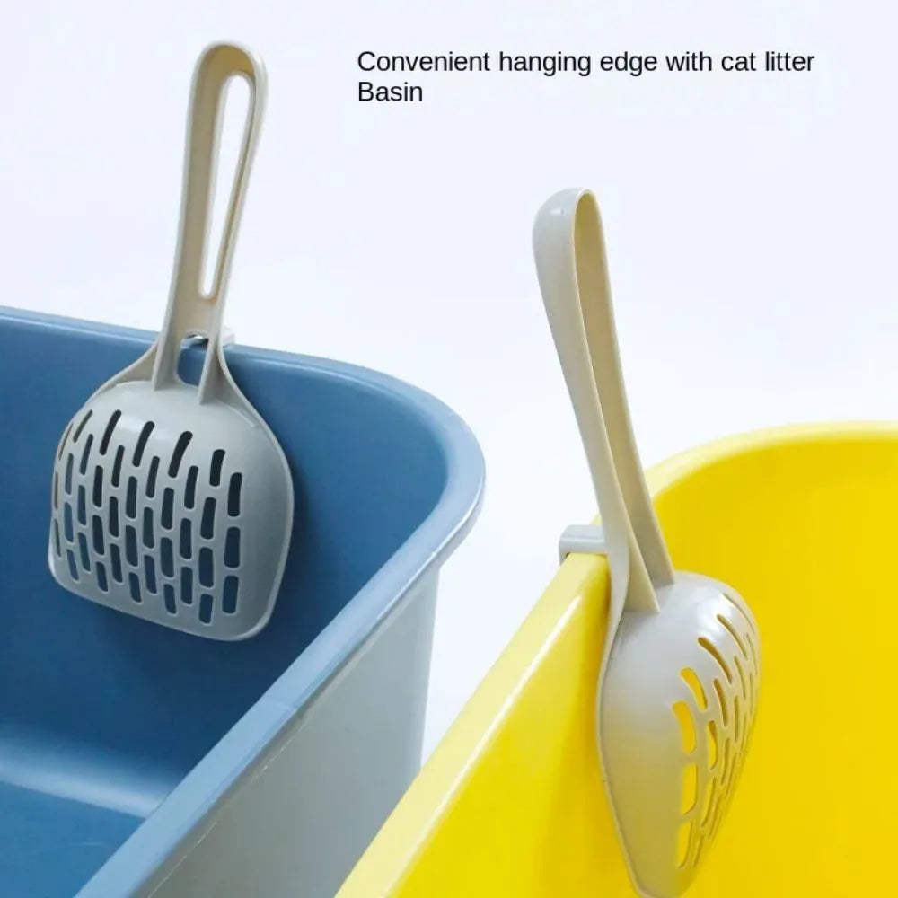 Grey plastic cat litter scoop with handle and stand-up base.