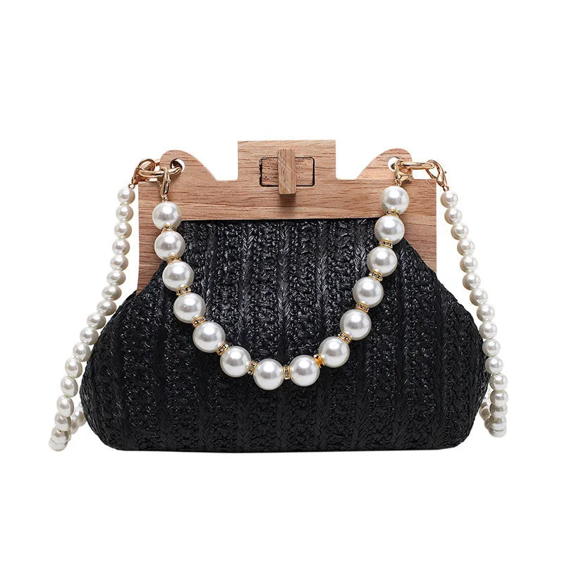 Women's woven straw shoulder bag with pearl chain strap in horizontal square shape