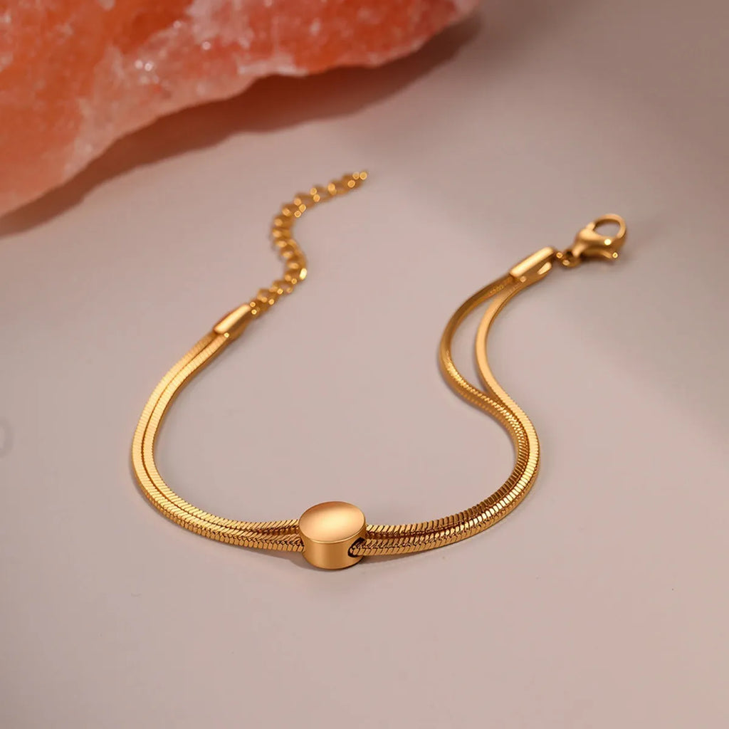 Women's 18K gold plated titanium steel snake chain bracelet on wrist