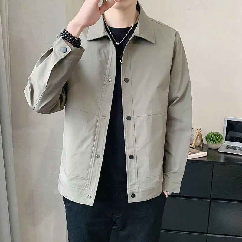 Man wearing a Korean style thin single-layer polyester jacket in light gray.
