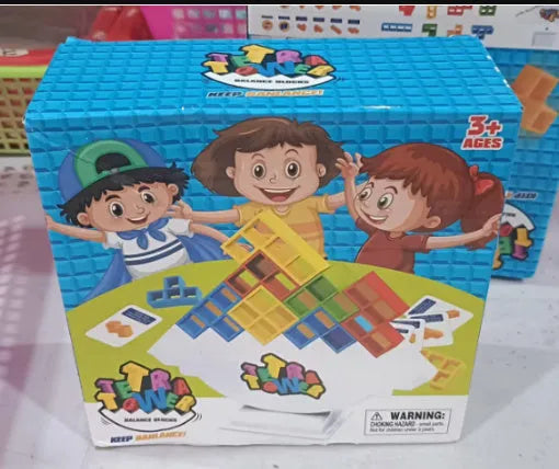 Plastic balance stacking game with 16 coloured building blocks, chassis, and base on a table