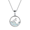 White gold electroplated necklace with a round geometric fishtail pendant in blue opal colour.