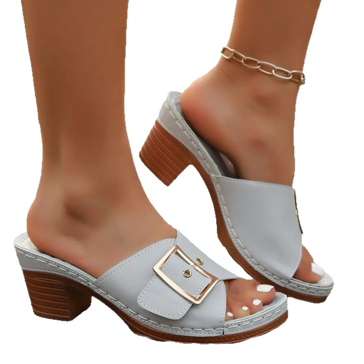 Women's black retro style slippers with a chunky heel and silver metal buckle on a rubber sole.