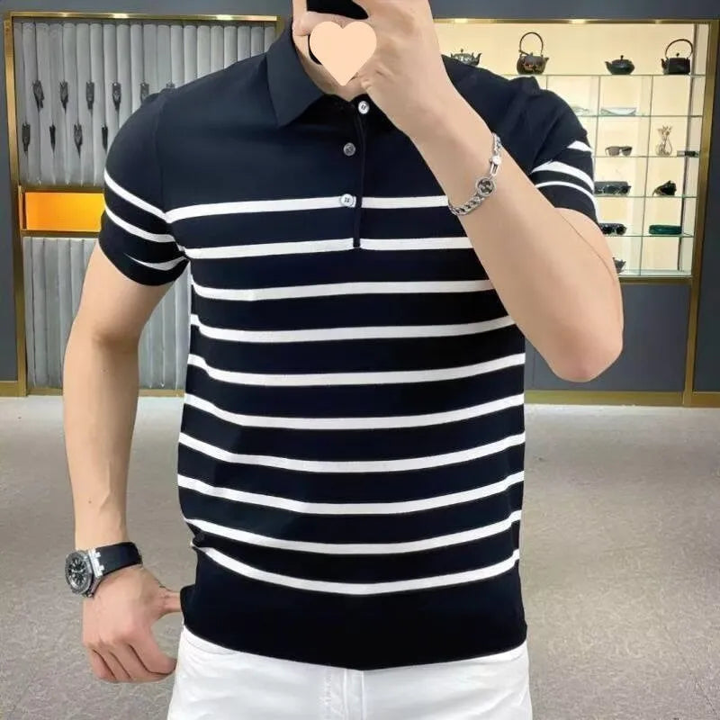 Man wearing a black and white striped knitted t-shirt with a lapel collar, showcasing a smart-casual look.