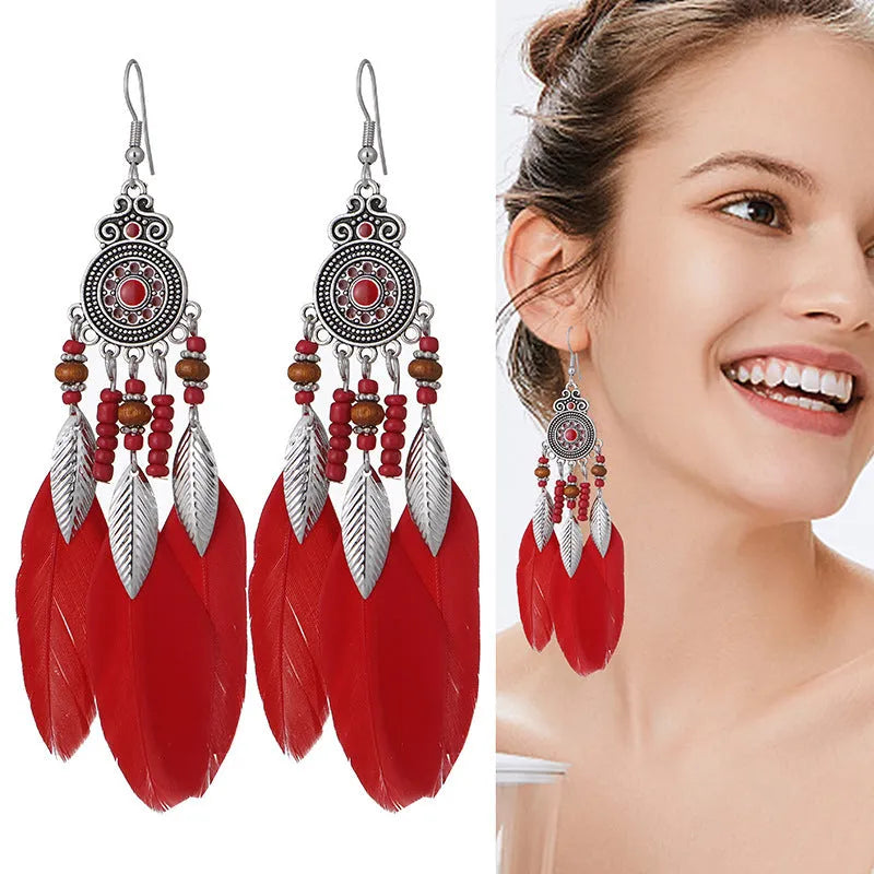 Round drop feather earrings with leaf detailing in various bohemian colours