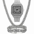 Gold Roman numeral square watch with diamond studs on a mesh band, plus bracelet and necklace.