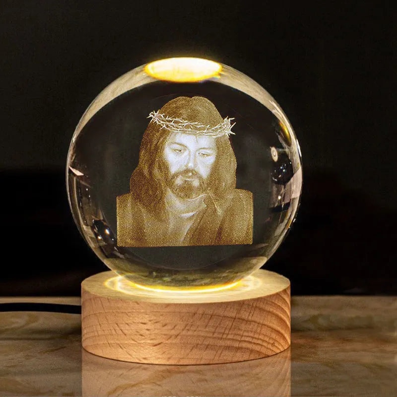 White crystal ball with cross and religious symbols on wooden LED base desk ornament