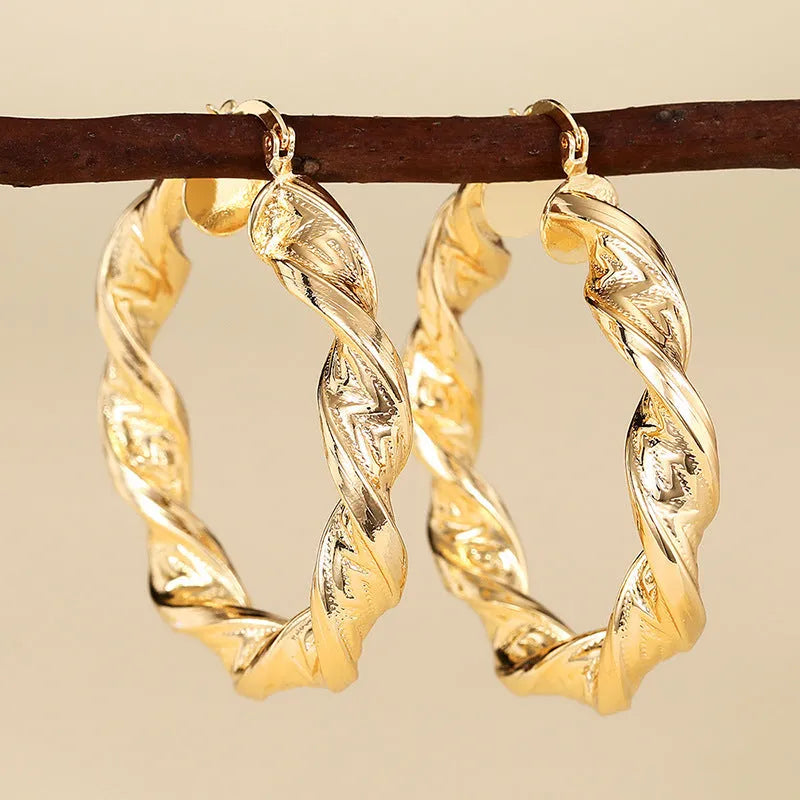 Women's geometric ring design ear clip earrings with drop-shaped elements and electroplated copper construction