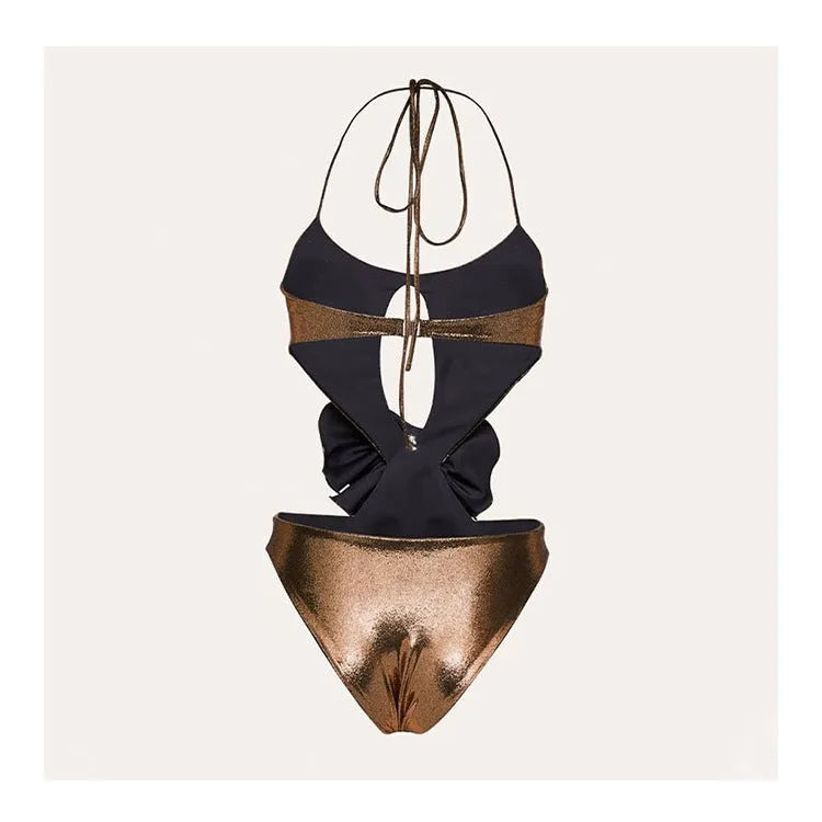 Handmade gold halter neck one-piece swimsuit with hollow out design on a mannequin.