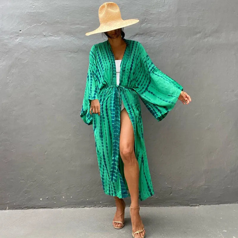 Woman wearing a printed cotton beach cover-up blouse in a DN0712 series colour.