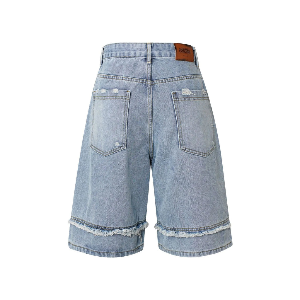 Men's distressed denim shorts with raw edges in black, straight leg cropped style