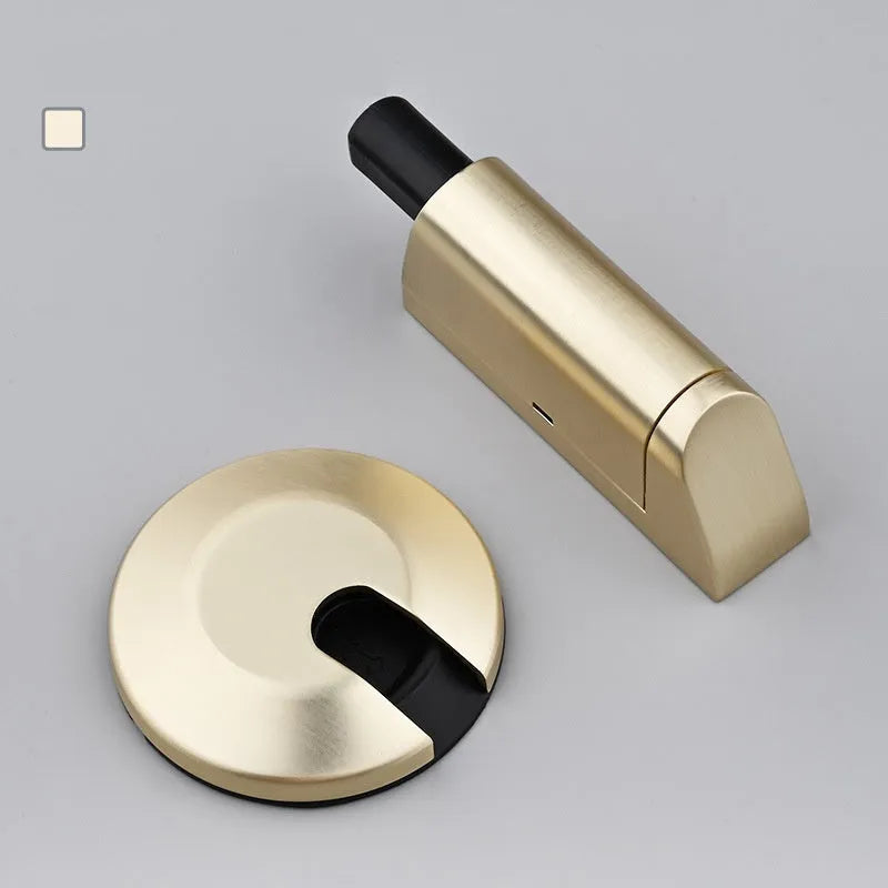 Modern invisible zinc alloy door stopper in six colour finishes on a wall.