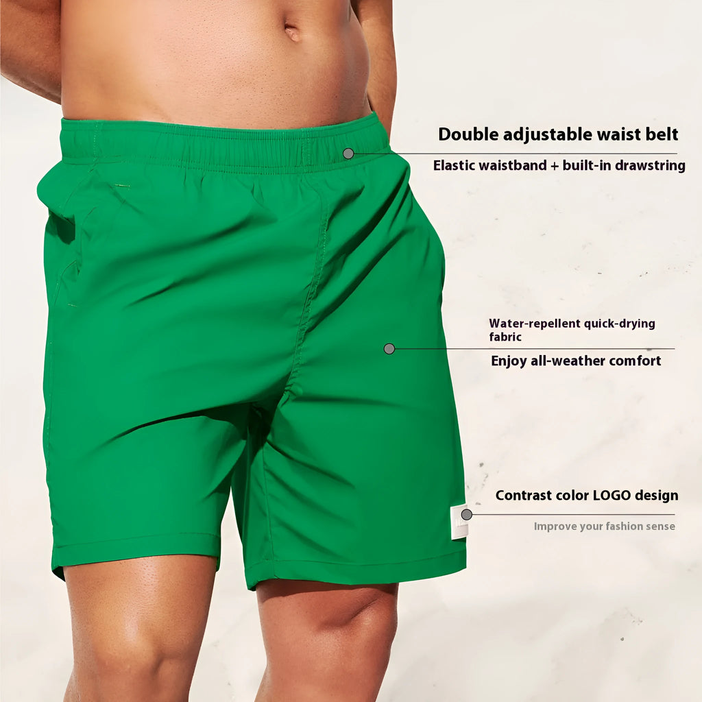 Men's quick-drying nylon sports shorts in green, shown with straight leg and elastic waist.