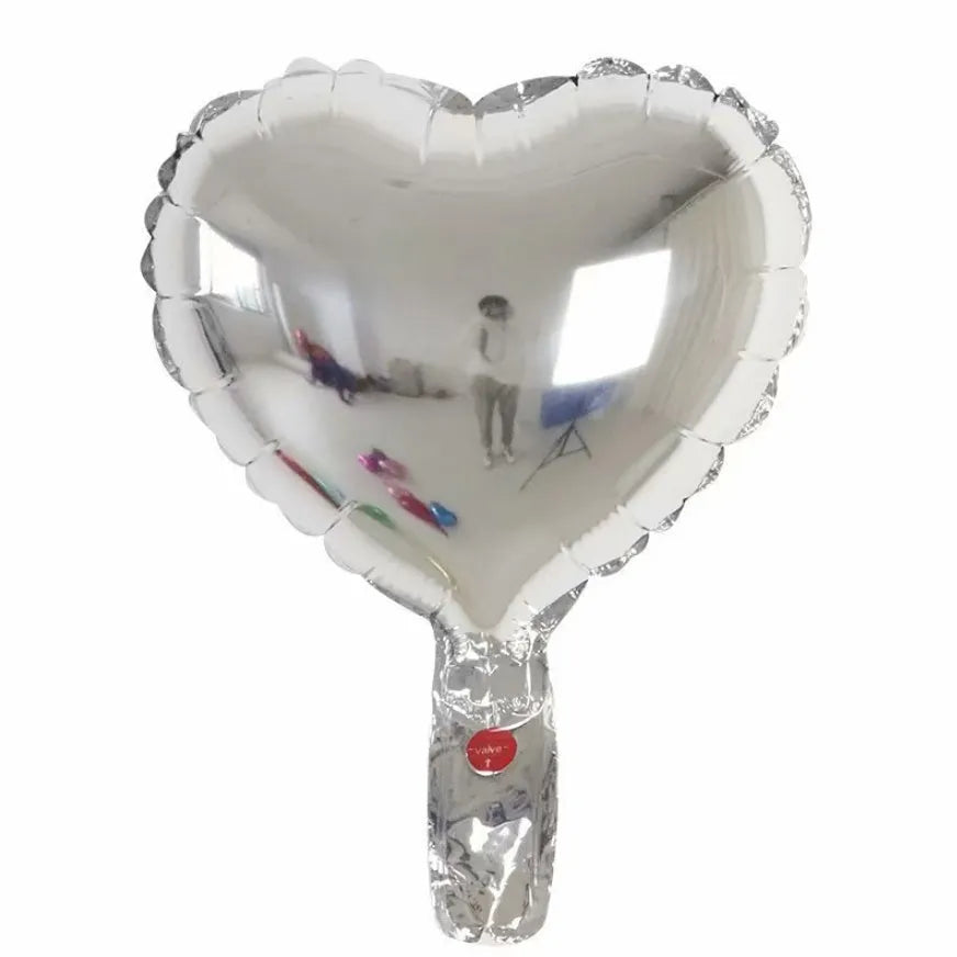 Five peach heart shaped aluminium foil balloons in metallic colours for party decorations