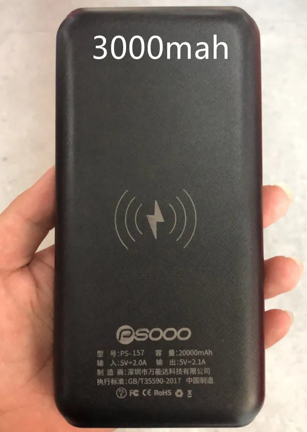 Black wireless solar power bank with Qi charging pad, three USB ports and an LED flashlight