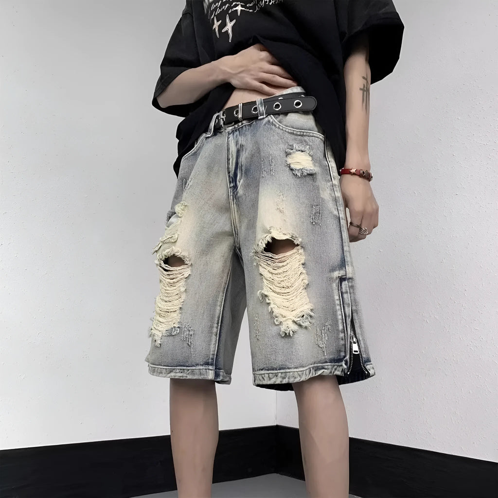 Blue retro-style denim shorts with a wide-leg loose fit and tattered details on a neutral background.
