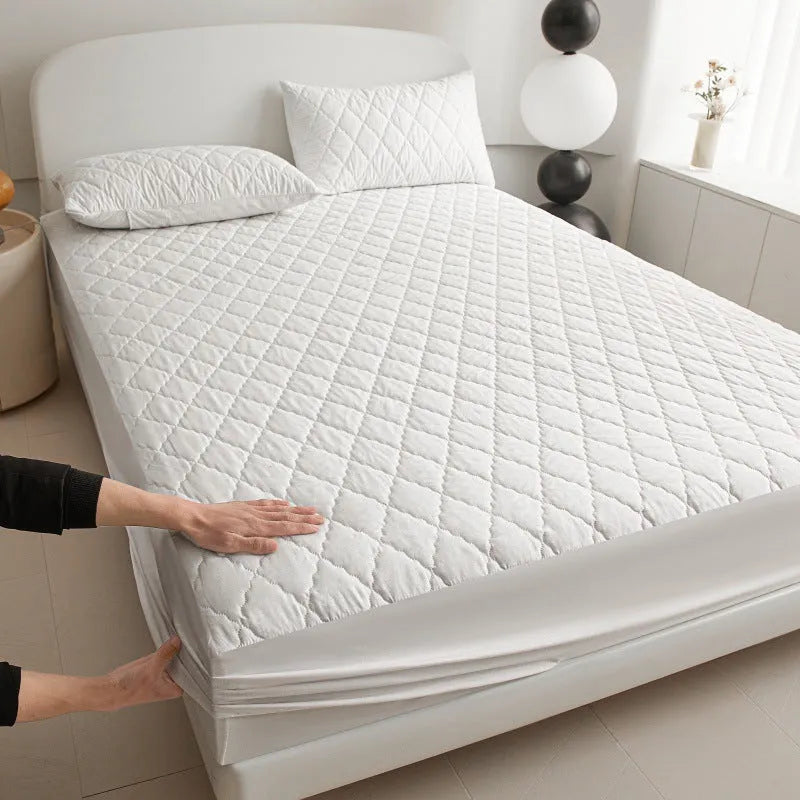 Diamond lattice quilted bamboo fibre mattress protector fitted sheet and pillowcases in solid colour.