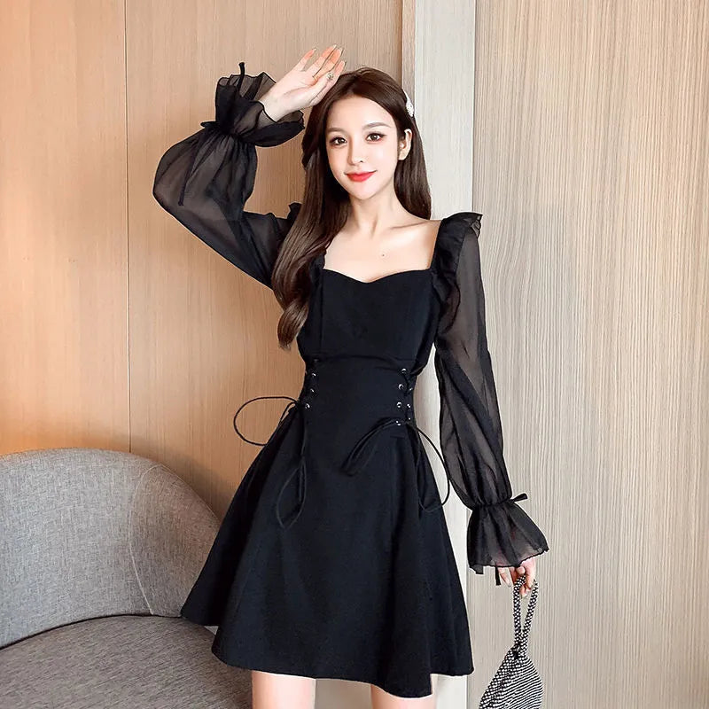 White chiffon patchwork waist-slimming dress with long sleeves and maxi skirt length on mannequin