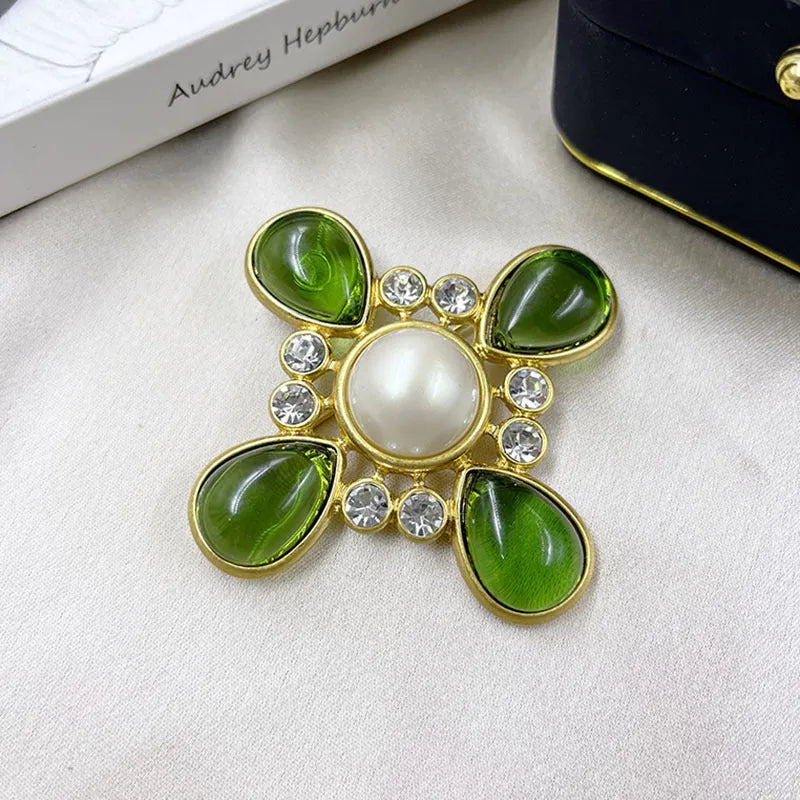 Close-up of a vintage zinc alloy baroque cross brooch with crystals, showing one of eight available colour styles.