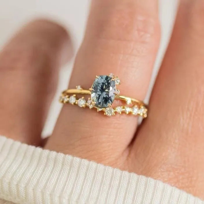Gold-plated women's ring with green zircon stone in floral design, showing detailed metalwork and stone setting