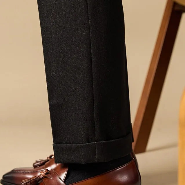 Men's black genuine leather tassel loafers with a rubber sole