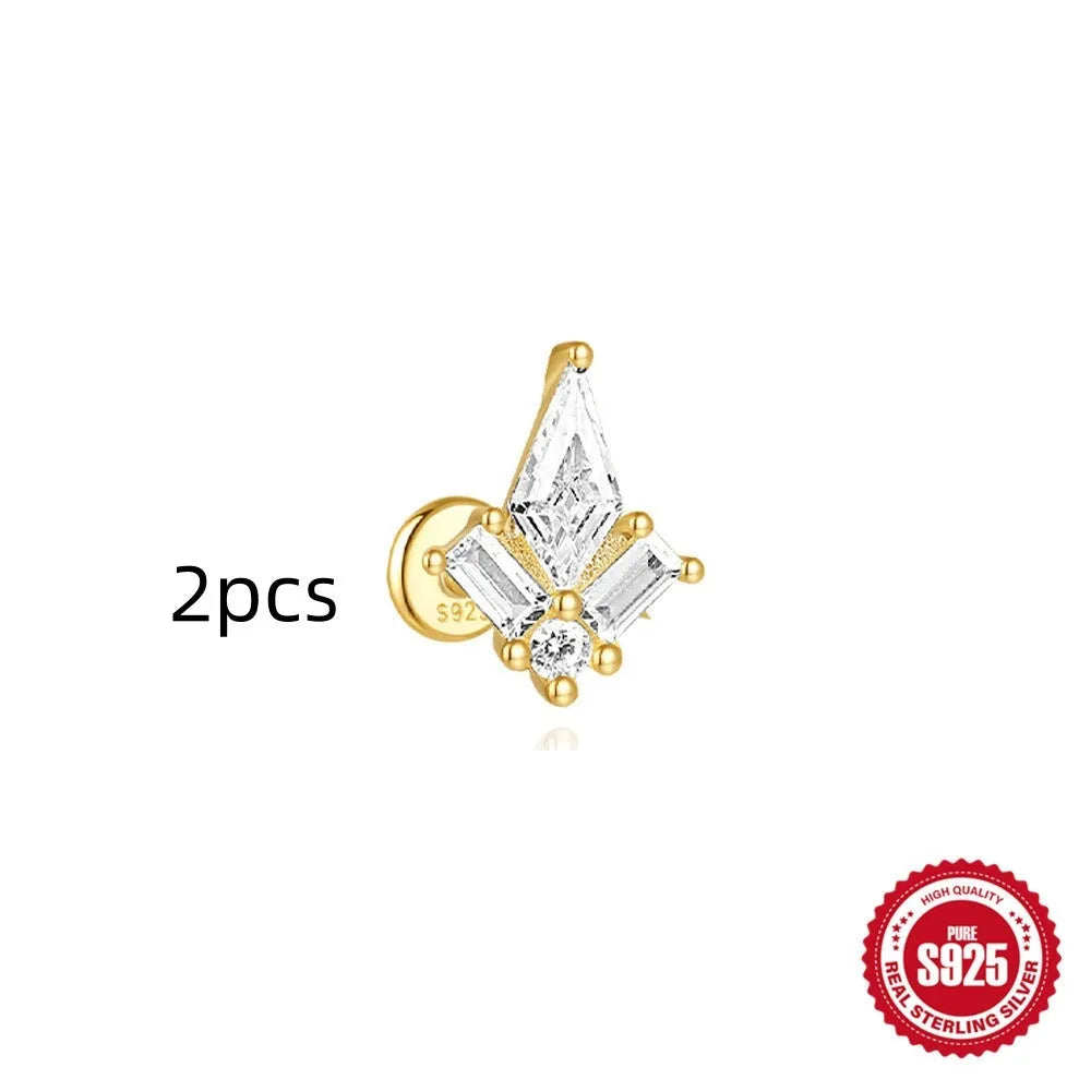 Geometric kite-shaped sterling silver earrings with a gold electroplated chain tassel featuring rhinestones.