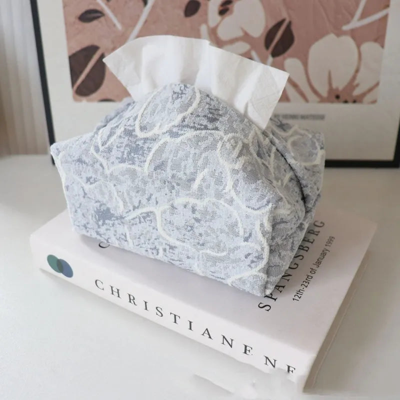 Cotton floral tissue box in beige, blue, or brown on a wooden table.