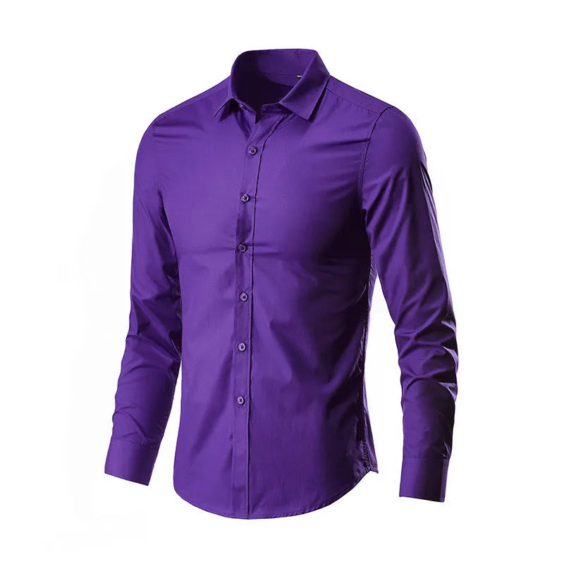 Man wearing a loose fit long-sleeve linen shirt in a neutral colour, showcasing the casual silhouette.