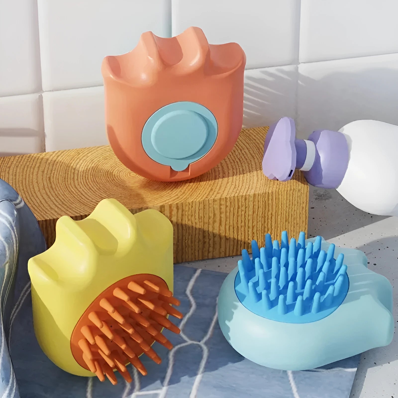Blue pet bath brush with shampoo reservoir measuring 9cm long with four massage nodes