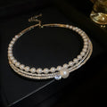 Women's silver curved clavicle chain necklace with a round geometric pendant.