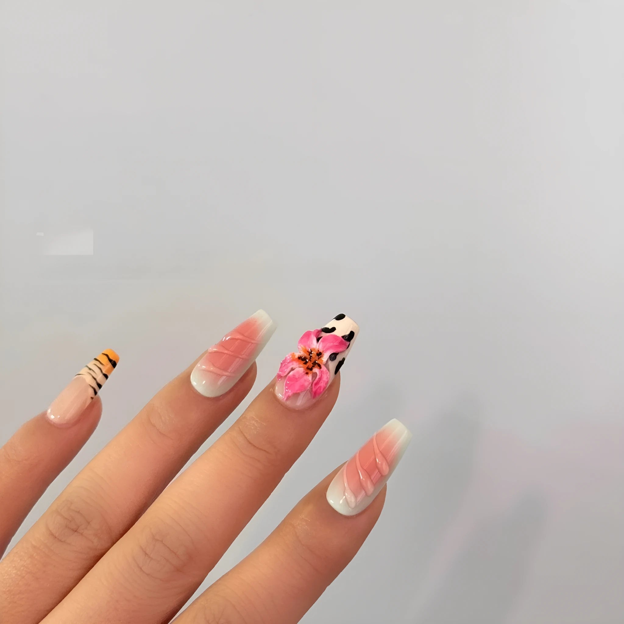 Zebra pattern lily hand carving nail art set showing flower, leopard print, and embossed designs in various sizes.