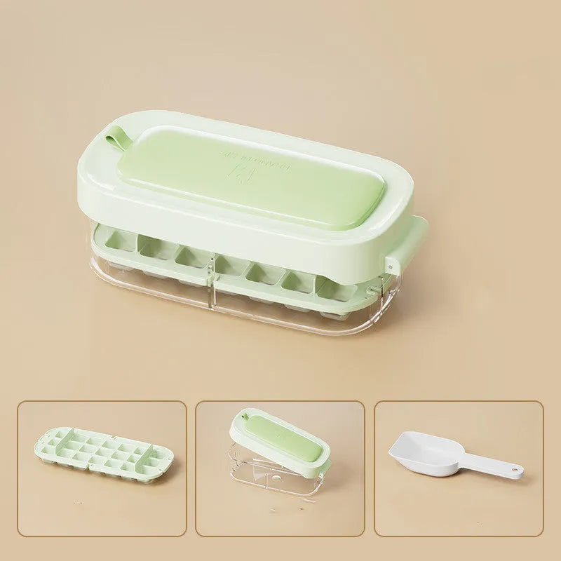 High-capacity ice cube tray in blue with leverage handle and integrated ice shovel storage compartment