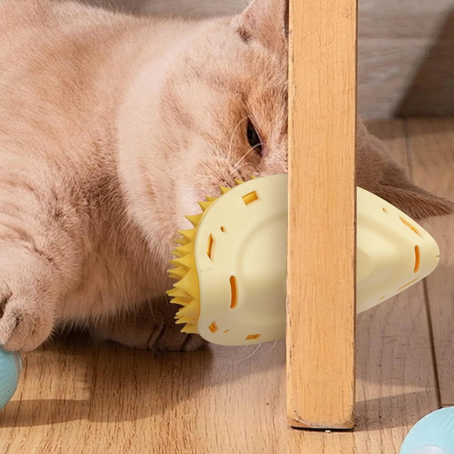 Yellow durian-shaped cat corner scratcher with spiked surface for wall mounting