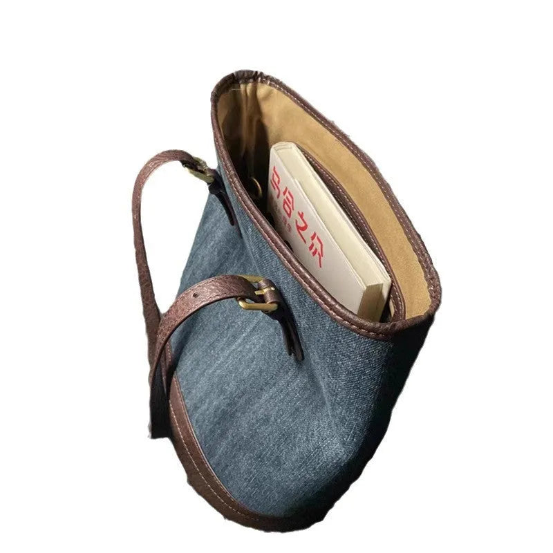 Blue denim patchwork one-shoulder bucket handbag showing retro style and large capacity.