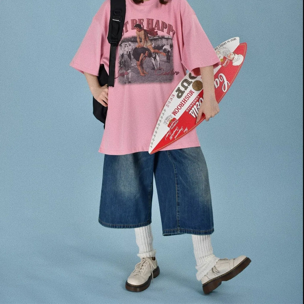 Men's loose fit jeans shorts in blue denim with a straight leg, shown on a model.