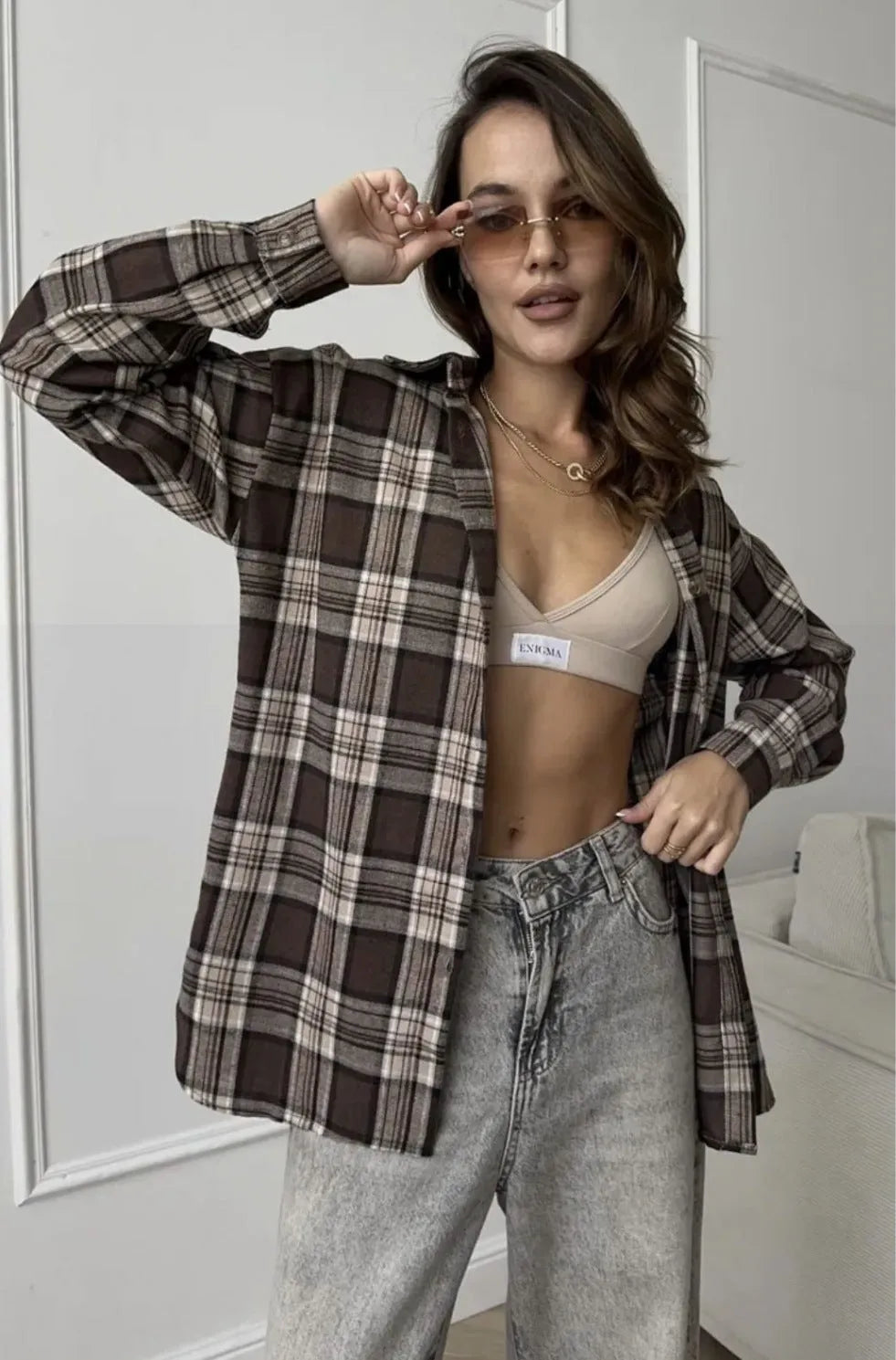 Dark brown retro striped women's cotton long sleeve shirt on hanger
