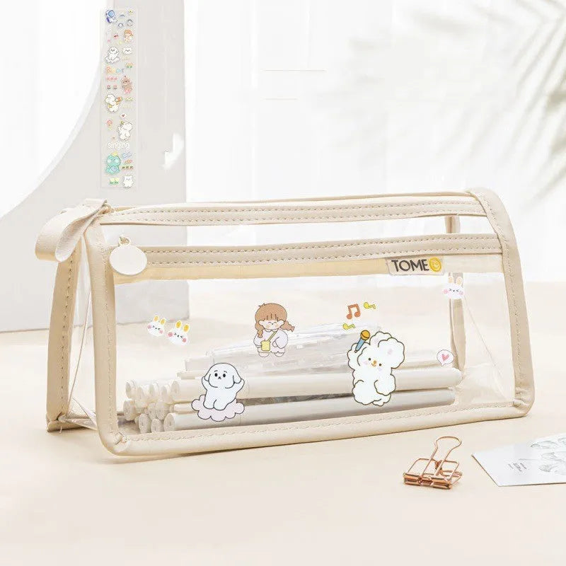 Transparent double-layer pencil case showing two compartments with writing instruments inside, dimensions 220x110x80mm
