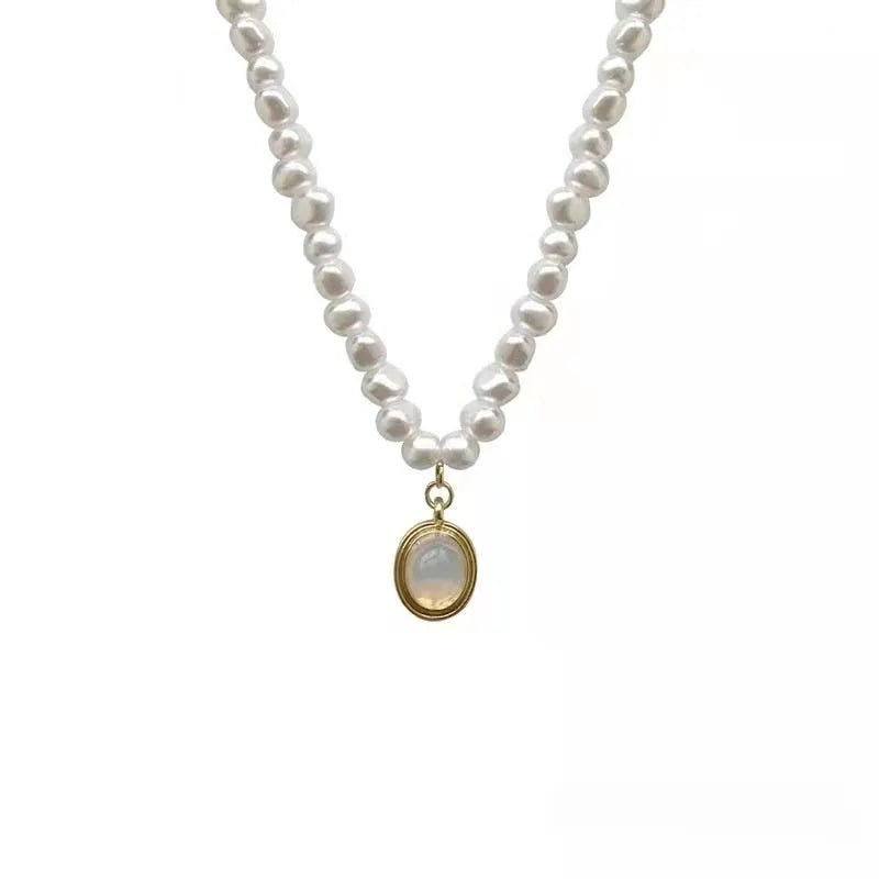 French Court vintage style alloy necklace with geometric pearl pendant on an adjustable chain.