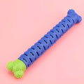 Blue and green silicone dog dental chew stick with textured cleaning surface and nodules for gum massage.