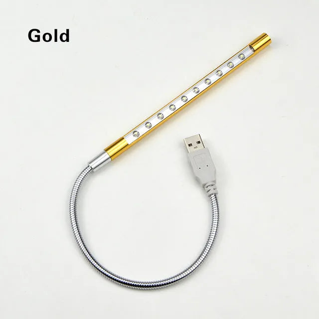 Spiral-shaped USB LED night light in metallic finish with aluminium alloy shade and metal base.