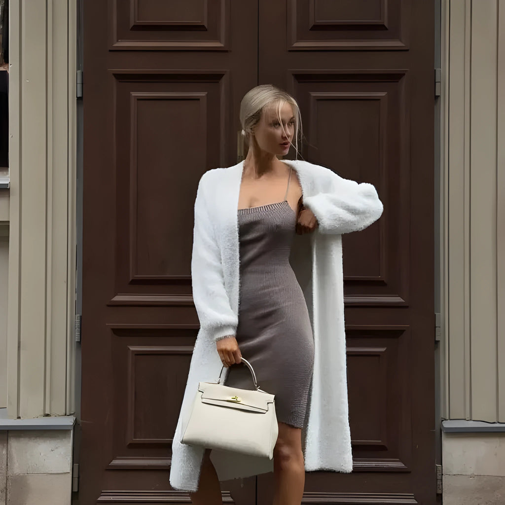 White longline knitted cardigan jacket with regular sleeves on a model.
