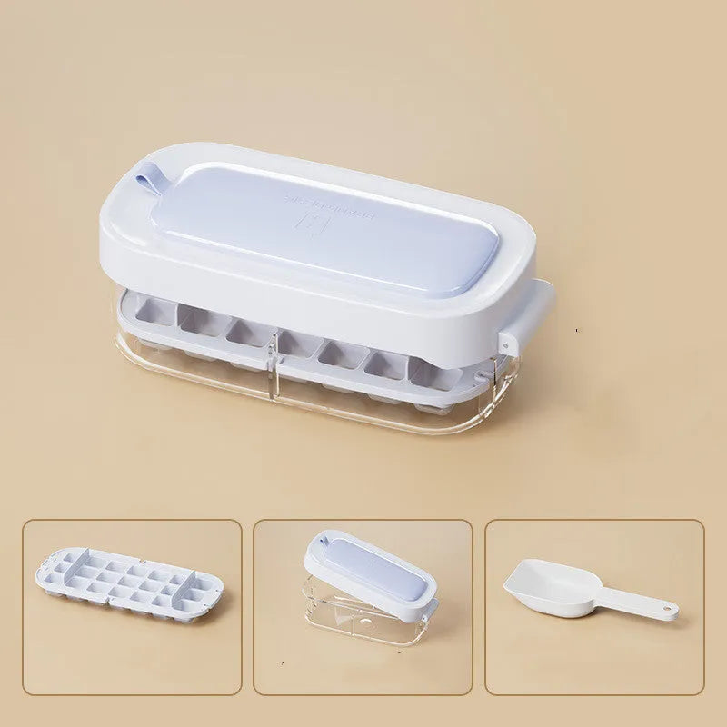 High-capacity ice cube tray in blue with leverage handle and integrated ice shovel storage compartment