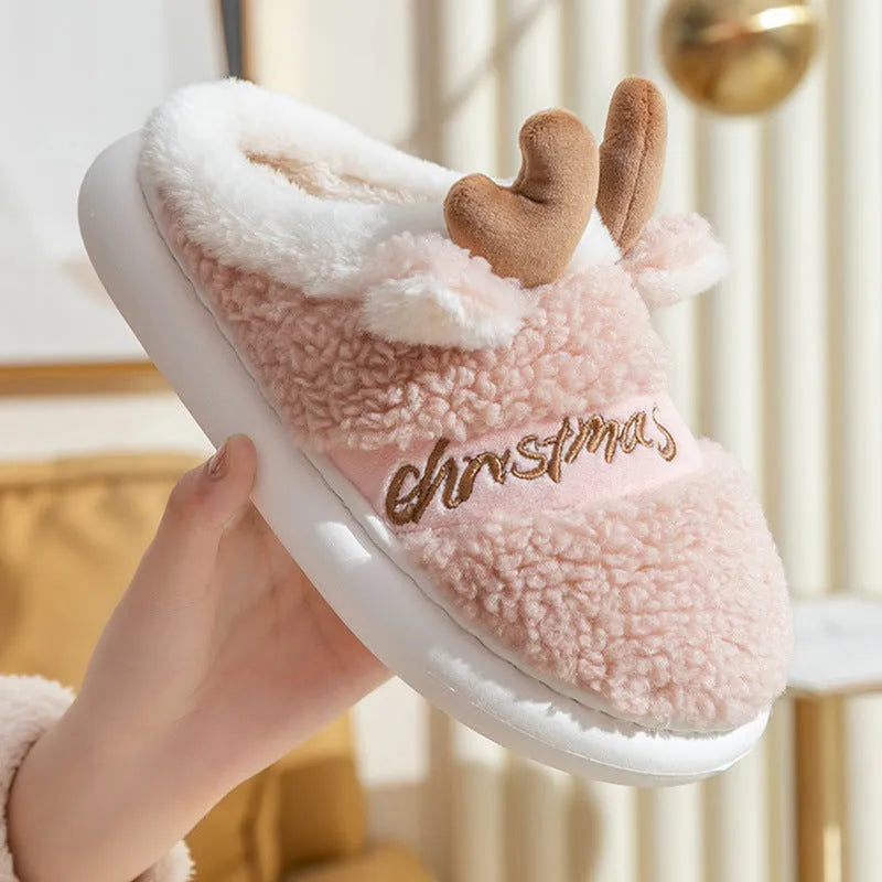 Pair of Christmas elk winter home slippers with suede upper, available in candy colours