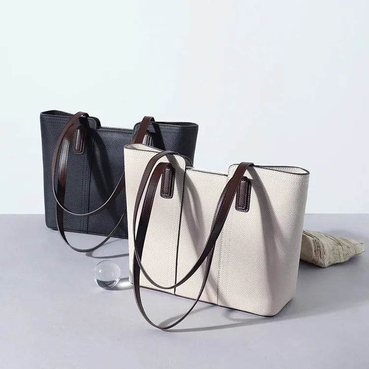 Genuine leather women's large shoulder bag in box-type design with sandwich pocket.
