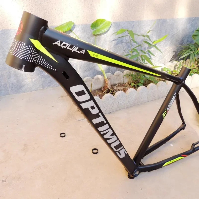 Black green 29-inch aluminium mountain bike frame with disc brake mount and internal cable routing ports.