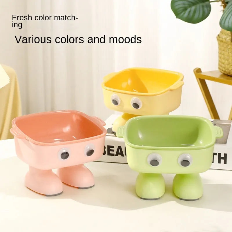 Robot-shaped elevated cat bowl with 15-degree tilt design in green colour
