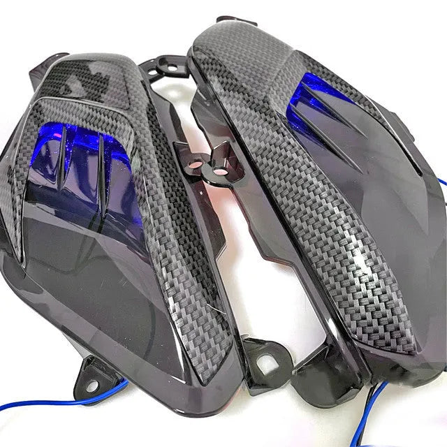 Pair of Yamaha NMAX LED side lamps with ABS plastic shell and choice of blue or red light.