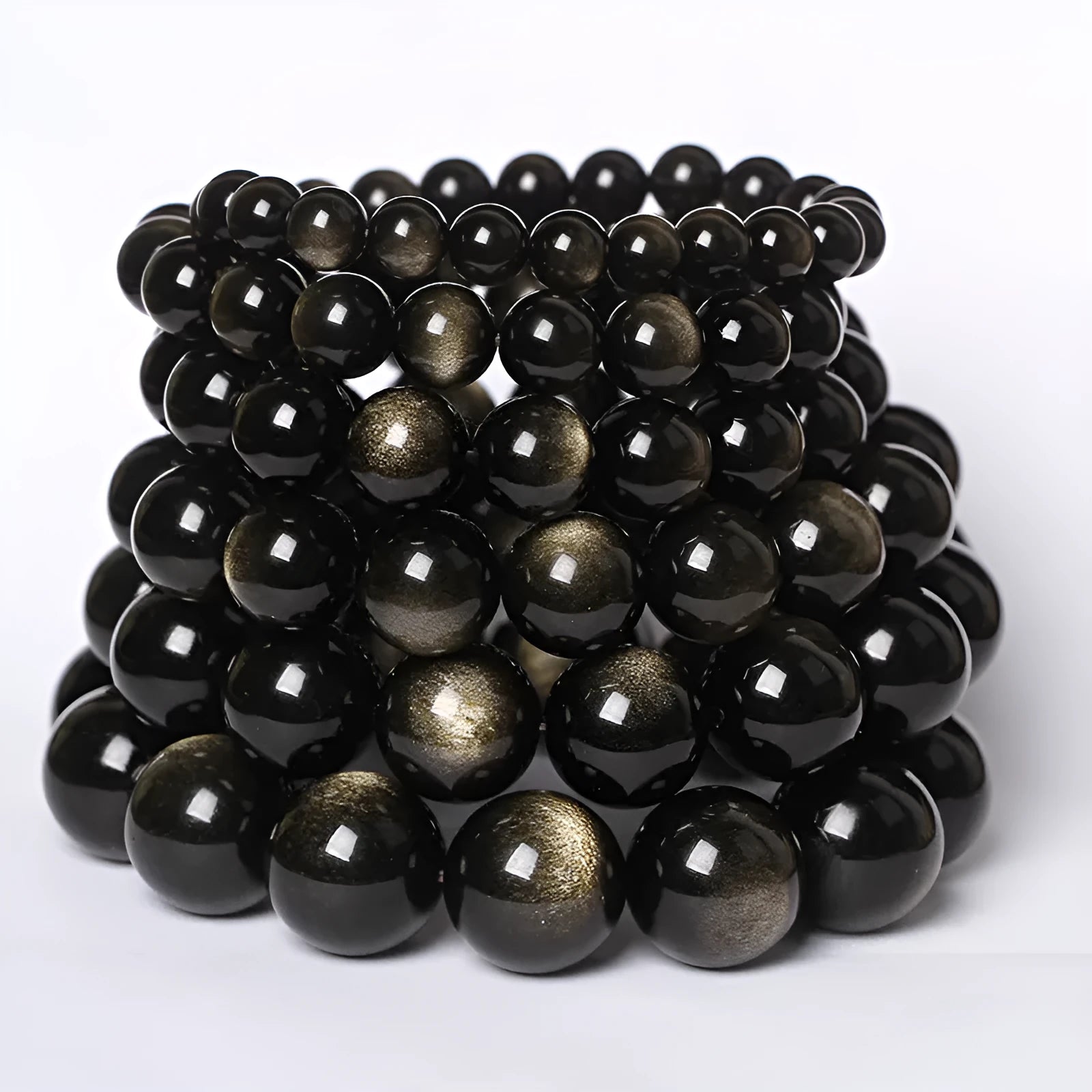 Hand-woven obsidian bracelet with round beads and engraved birth year detail for couples