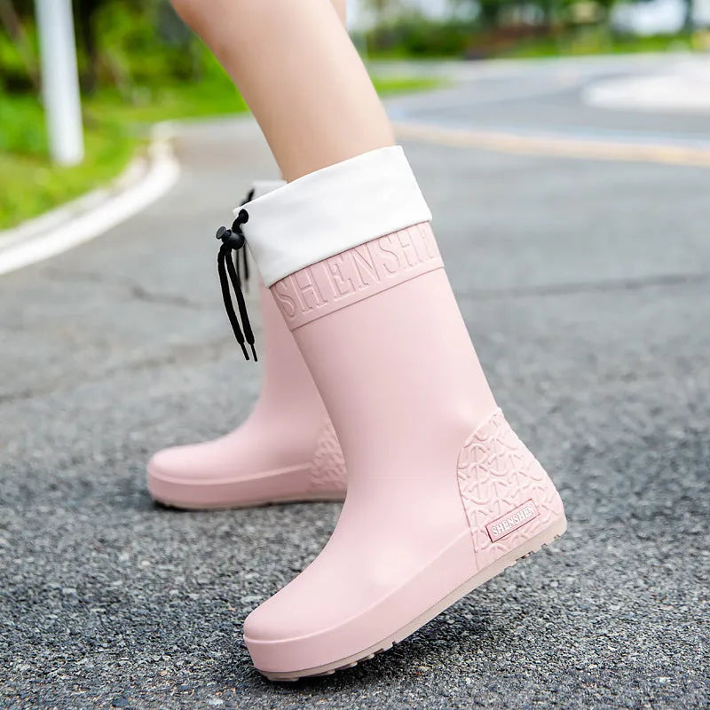 Women's non-slip PVC rain boots in apricot, black, brown and pink colours with wear-resistant soles
