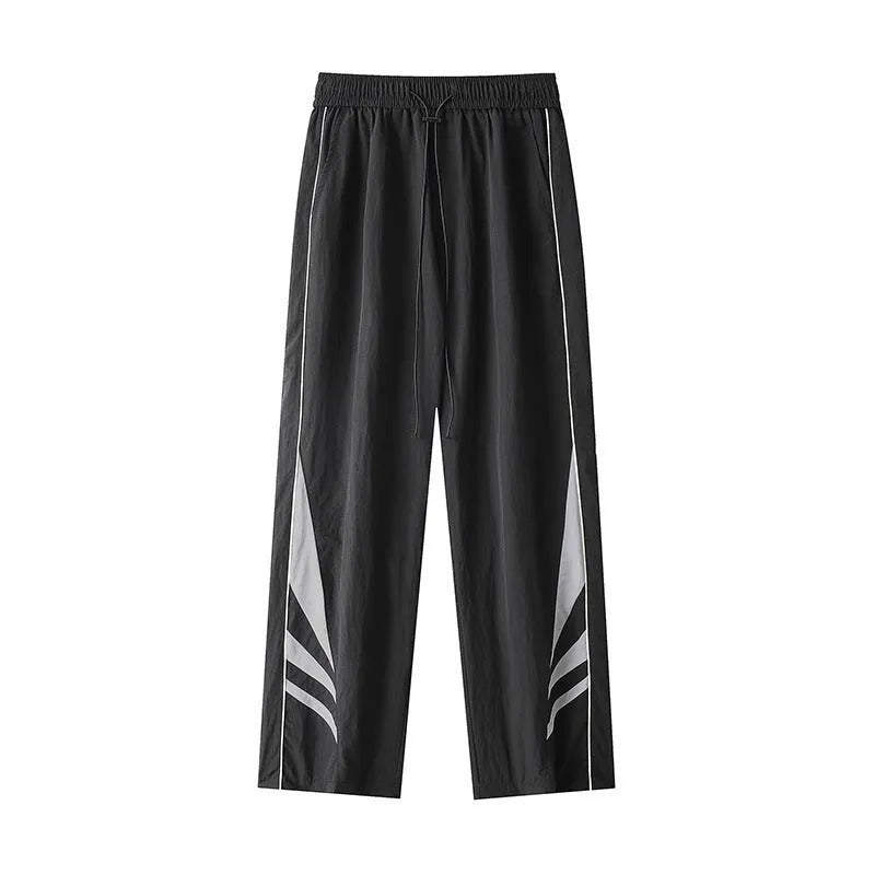 Men's straight-leg sports trousers in black with elastic waistband and button front